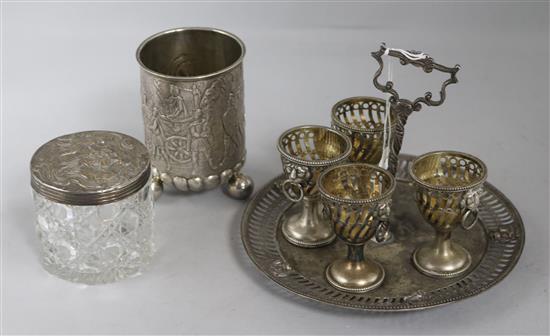 A Victorian silver egg cruet stand, lacking one cup, 16.8oz., A Victorian silver lidded glass jar and a German white metal cup, 6.3oz